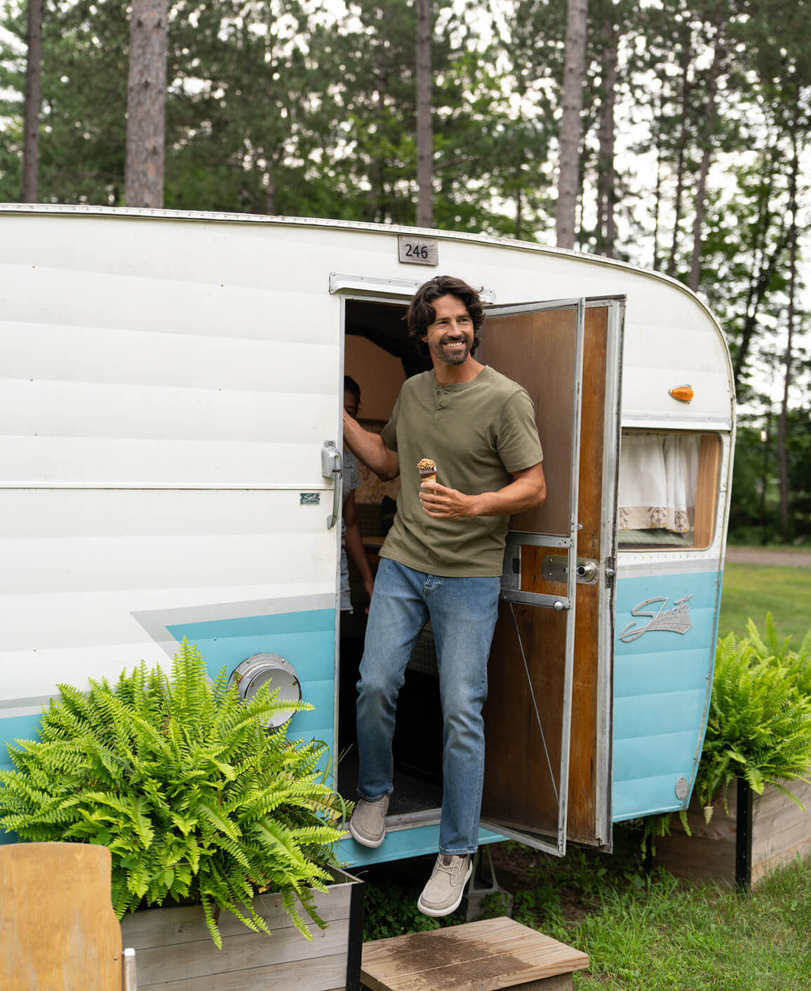 Image features a man stepping out of a camper wearing the Nunn Bush Brew City slip on.